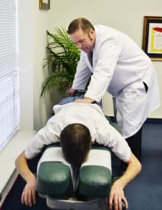 Chiropractor 77095 TX Scott William Stelmach Adjusting Patient's Back